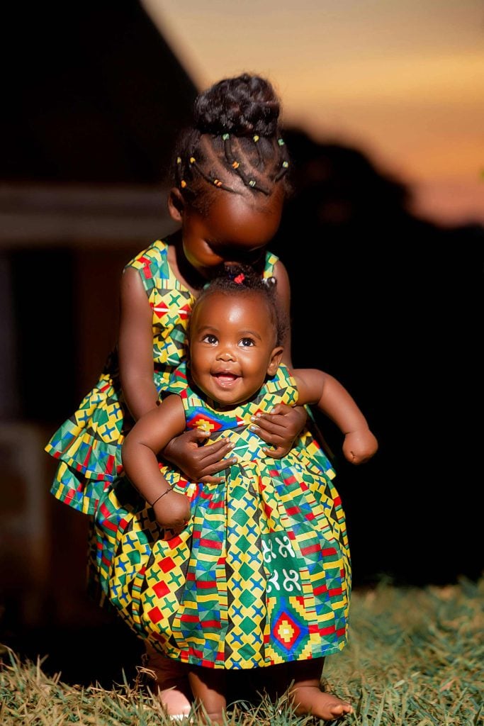 African Siblings in Traditional Dresses