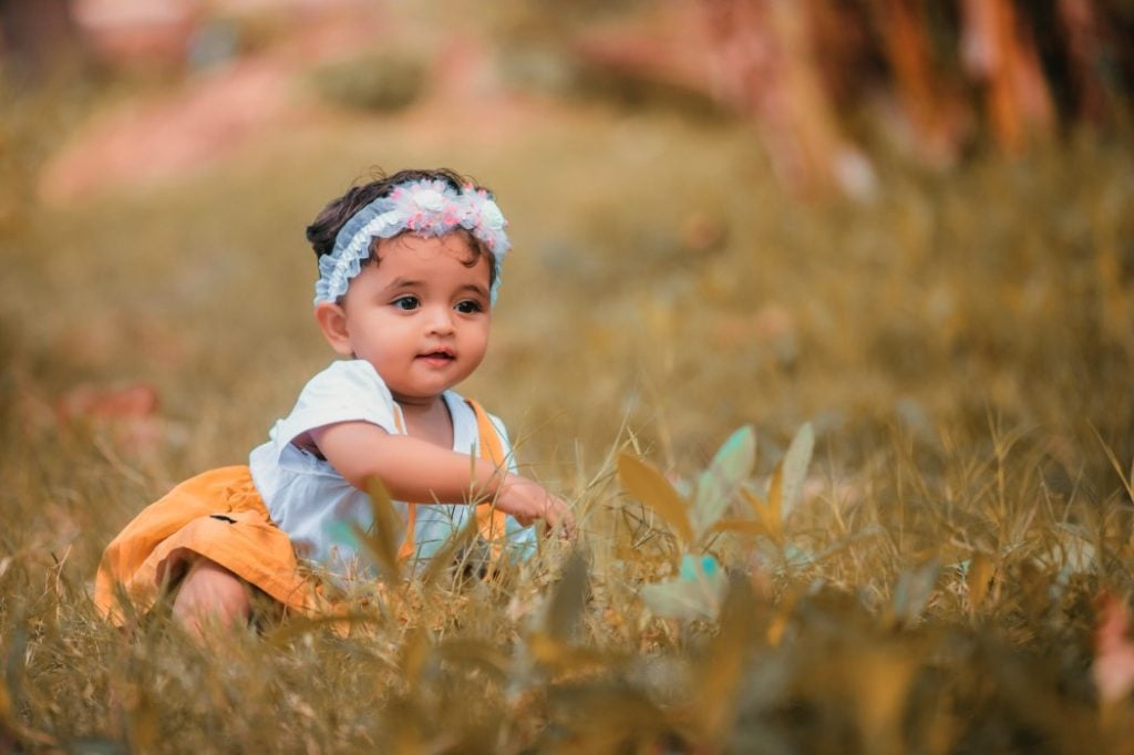 Baby Girl Playing Outside in Spring